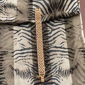 Size seven and a half gold tone and rhinestone bracelet,designed by KJL.